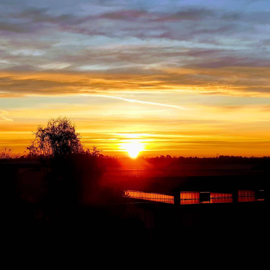 Photo of a sunrise with the sun in the center